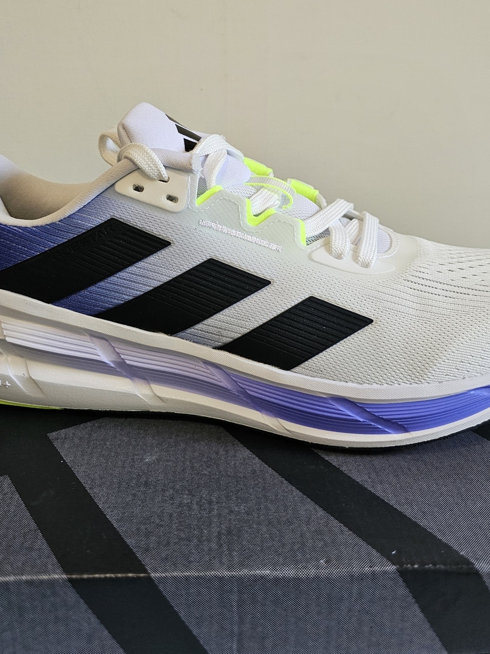 Adidas Men’s White Running Shoes with Black Stripes and Purple Accent